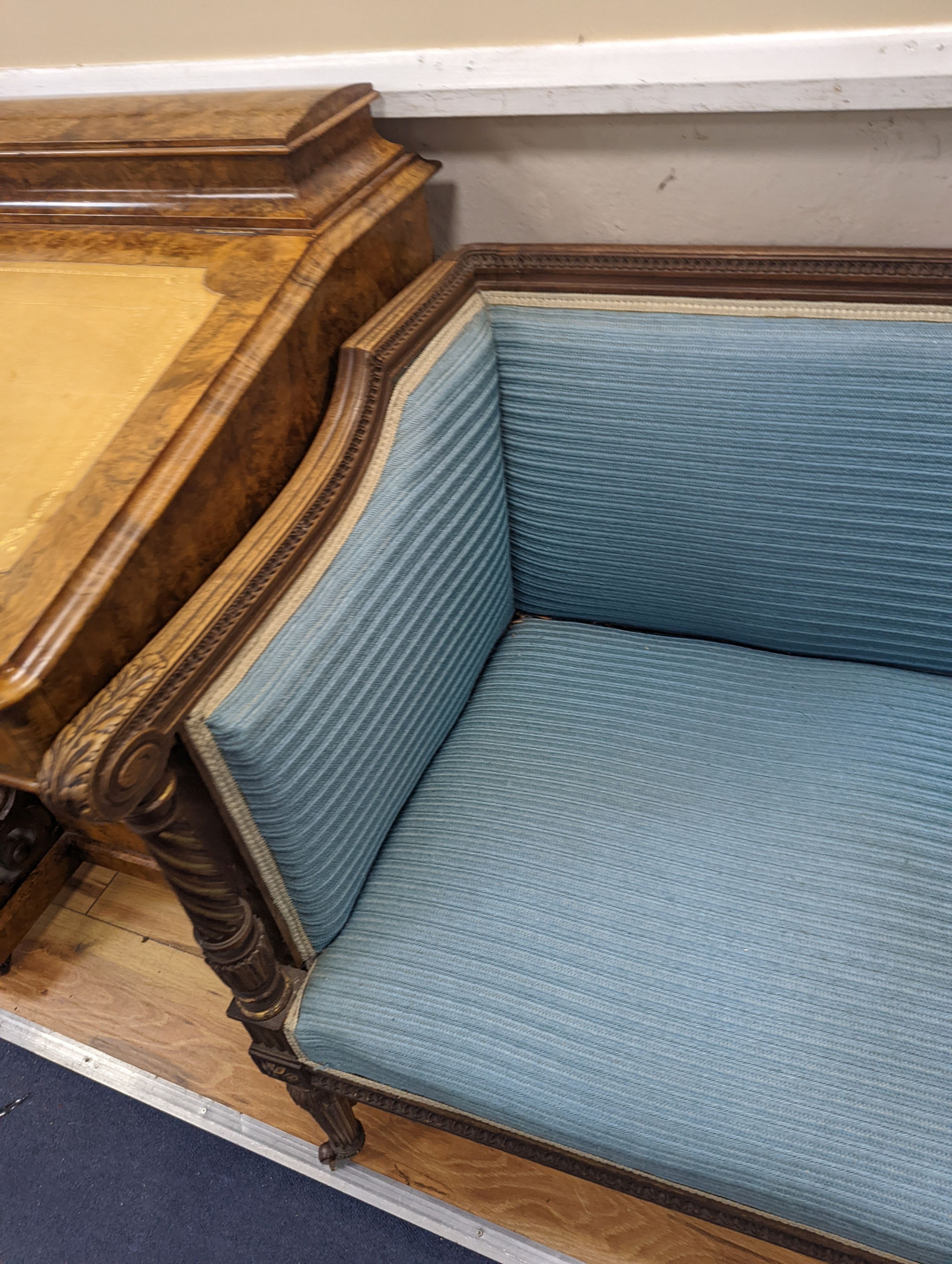 A pair of French walnut and parcel gilt Bergere chairs, width 71cm, depth 59cm, height 72cm